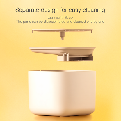 A pet water fountain with a detachable part on a yellow background, highlighting ease of cleaning.