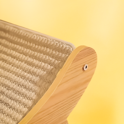 Close-up of a wooden scratching board with textured head on a yellow background